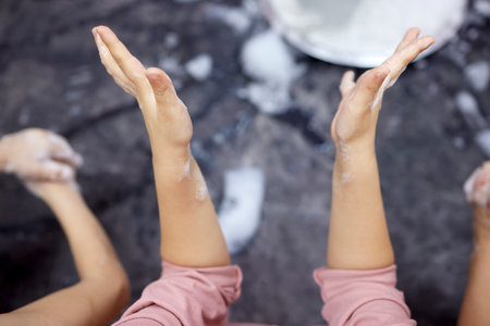 Childrens hands in soapy foam.Clean hands concept. Hygiene and health.