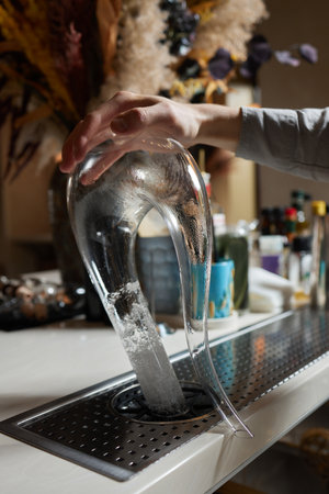 sommelier man wiping dishes decanter for wine. steam cleaner
