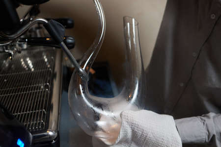 sommelier man wiping dishes decanter for wine.