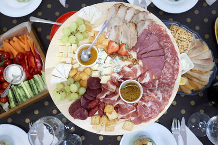 Snack cheese delicacies: parmesan, dorblu, camembert, cheddar, cheese sticks for vodka, beer, wine.