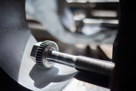 Close up of the CNC lathe jaw clamping raw material steel rod .Steel Cylinder part after turning...