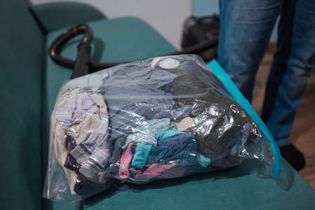 Space saver saving seal bag sucking air vacuum clothing storage compressed package.の写真素材