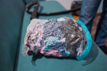 Space saver saving seal bag sucking air vacuum clothing storage compressed package.の写真素材
