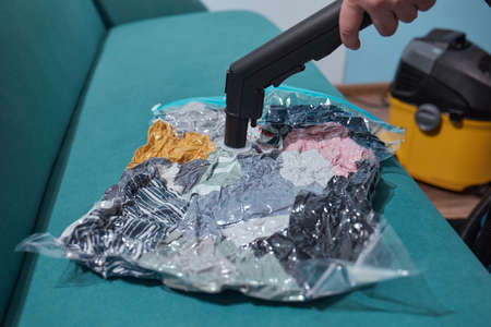 Space saver saving seal bag sucking air vacuum clothing storage compressed package.の写真素材