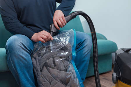 Space saver saving seal bag sucking air vacuum clothing storage compressed package.の写真素材