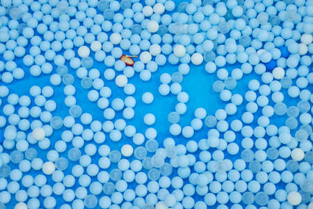Multicolored plastic toy fish in pool for childrens fishing, concept game.