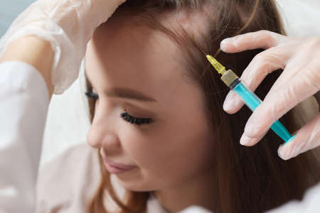 Plasma treatment, plasmolifting or PRP method point the introduction of the patients own plasma enriched with platelets, in the problem areas of the skin.の写真素材