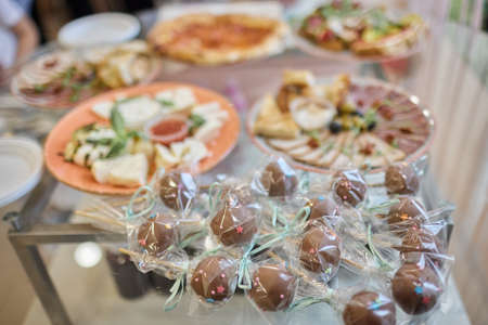 a lot of cold snacks on buffet table, catering.の写真素材