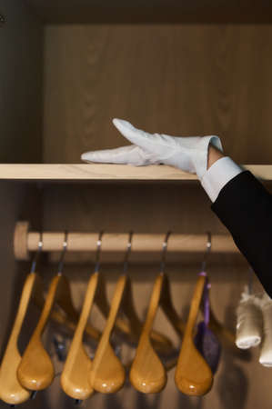 Adult chambermaid and hotel manager cleaning the roomの写真素材