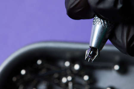 Piercing earrings close-up. On a black background.