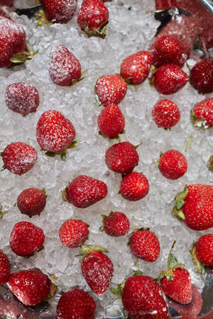 Strawberry ice. Preparing summer ice for party cocktails, ice-cream and desserts. Freshness.の写真素材