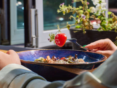 Caesar salad with croutons, quail eggs, cherry tomatoes and grilled chicken.