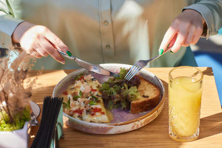 Omlet with mushrooms in a pan on a concrete background. Fritata is an Italian breakfast dish.