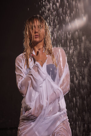 Wet woman face with water drop. Moisturizing.の写真素材