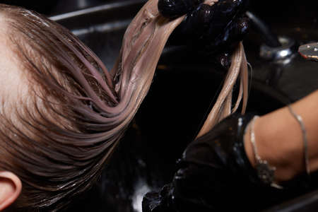 Airtouch Hair stylist makes bouffant using comb on thin strands. Shatush technique for hair...