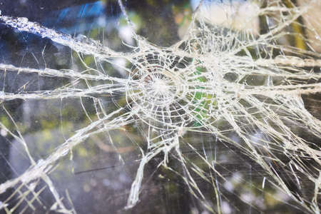 Broken glass in car. Close-Up Of Shattered Windshield.
