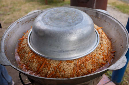 Hiking pot, Bowler in the bonfire. in cauldron at the stake. Traveling, tourism, picnic cooking, cooking at the stake in a cauldron, fire and smoke.の写真素材