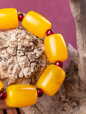 Colorful beads made of natural semiprecious stones on a white background. Isolated jewelry close up. Stone texture, energy mineral, beaded necklaces, rock.の写真素材