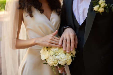 Bridal Bouquet In Brides Hands. Bride in the garden.の写真素材