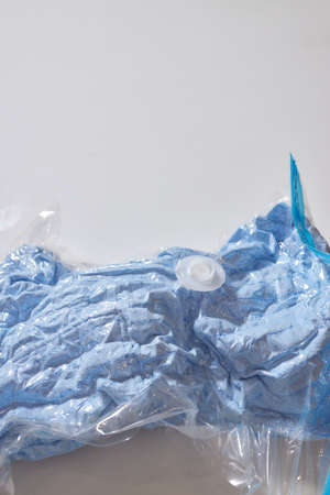Space saver saving seal bag sucking air vacuum clothing storage compressed package.