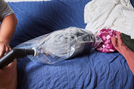Space saver saving seal bag sucking air vacuum clothing storage compressed package.の写真素材