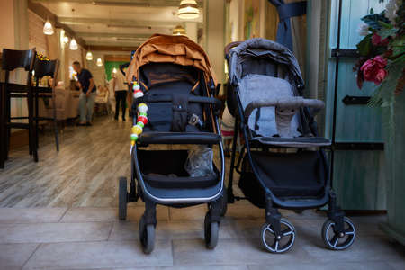 empty baby stroller near the open entrance to the store.の写真素材