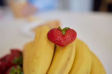 Fresh strawberry slice heart shape in bowl decorate for Valentine day.の写真素材