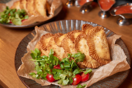 hot homemade pasties on a wooden board copy space.の写真素材