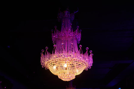 Close-up of a beautiful crystal chandelier Beautiful chandelier. luxury expensive chandelier hanging under ceiling.の写真素材