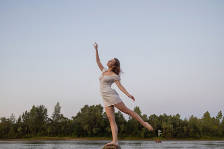 Outdoors fashion photo of beautiful bohemian lady at river.の写真素材