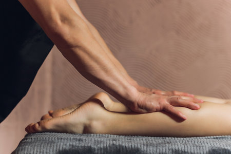 A foot massage being carried out in a spa by a masseuse.の写真素材