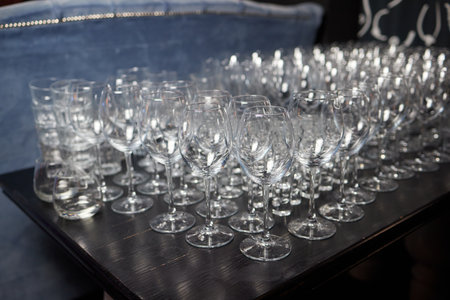 Empty clean champagne glasses on counter in bar.の写真素材