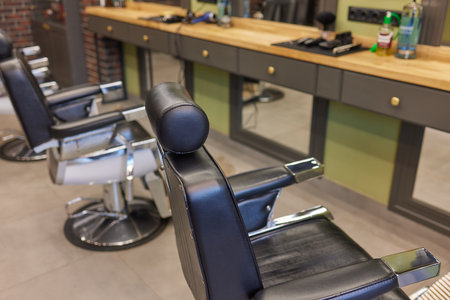 Barbershop armchair. Modern hairdresser and hair salon, barber shop for men.の写真素材