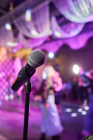 Retro microphone on stage in a pub or American Bar restaurant during a night show.の写真素材