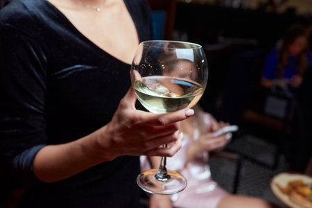 close-up of gorgeous woman with a glass of champagne. party and holiday celebration.の写真素材