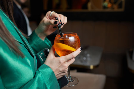 Italian Aperol Spritz cocktail with orange slices on gray stone table. Summer drink, homemade sangria.の写真素材