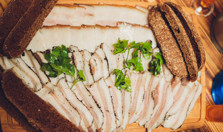 Russian appetizer for vodka. Lard and rye bread. Meat platter. Food background.の写真素材