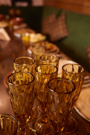 Wine glasses in warm light loft restaurant.の写真素材