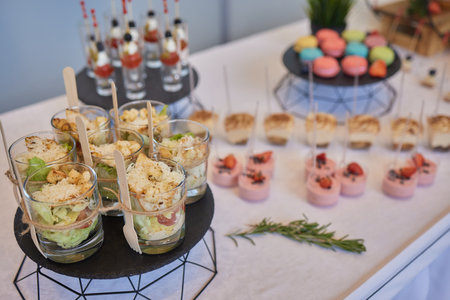 Different types of canapes on buffet table.