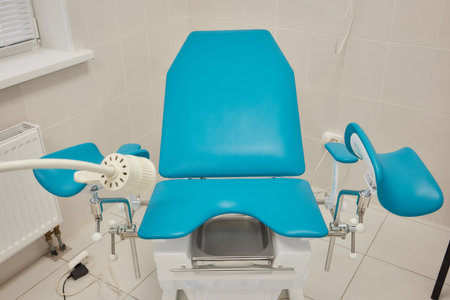 Gynecological cabinet with chair and medical equipment.の写真素材