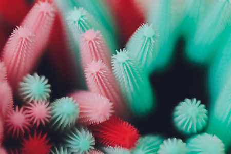 Pink makeup brushes, eyelash combs and eyebrows on white background with copy space.の写真素材