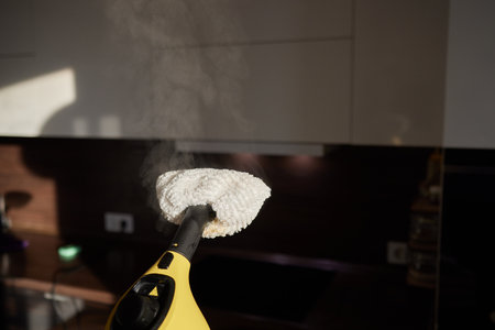 cleaning the kitchen with a steam cleaner, disinfection and sterile.の写真素材