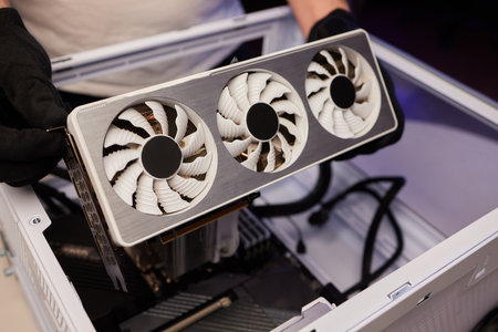 Changing the thermal paste on the graphics processor. Disassembled graphics card on the table. Old...
