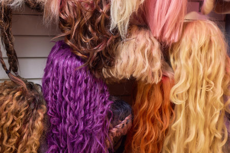 Close up brown and another color of hair wigs display in beauty salon.の写真素材