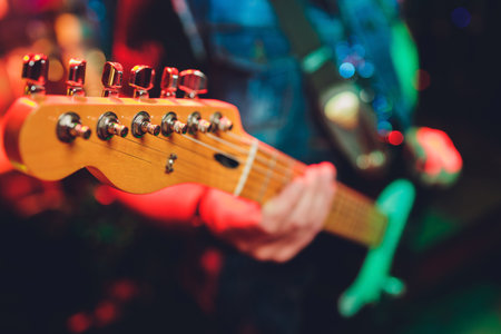Closeup of blurry male hands playing the guitar.の写真素材