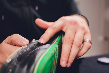 Brushes, wax, boots. applying cream with your finger. Shoe repair.の写真素材