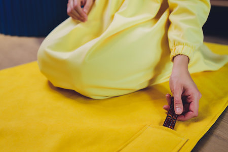 Muslim woman in hijab praying on mat indoors.の写真素材