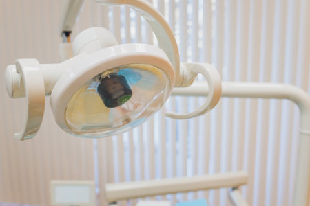 The hand of the dentist with a light.の写真素材