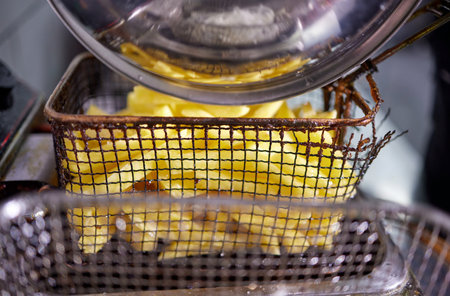 Dirty cooking area with french fries deep fryer.の写真素材