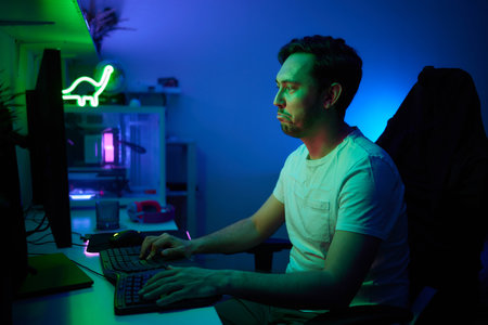 Player looking at his computer screen, contemplating his next move in an online video game.